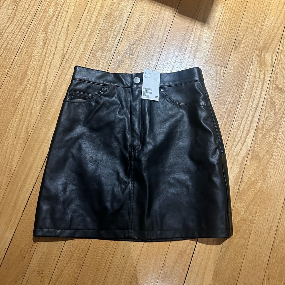 TWO leather skirts